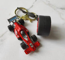 Load image into Gallery viewer, Formula-1 Racing Car &amp; Tire Keychain Featuring a Combination of Two Car Elements
