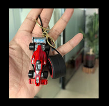 Load image into Gallery viewer, Formula-1 Racing Car &amp; Tire Keychain Featuring a Combination of Two Car Elements
